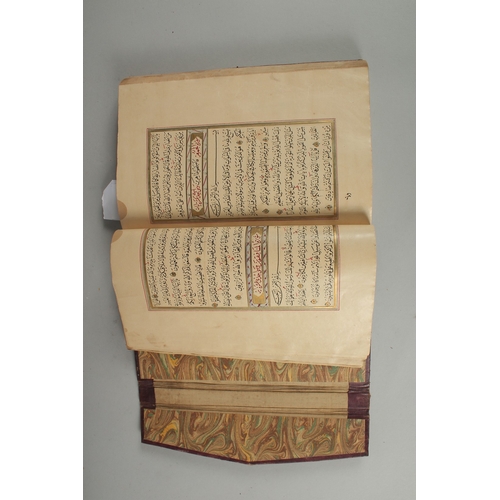 240 - AN 18TH CENTURY OTTOMAN LEATHER BOUND ILLUMINATED QURAN, the manuscript written in naskh in black in... 