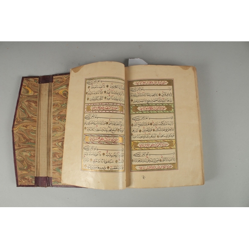 240 - AN 18TH CENTURY OTTOMAN LEATHER BOUND ILLUMINATED QURAN, the manuscript written in naskh in black in... 