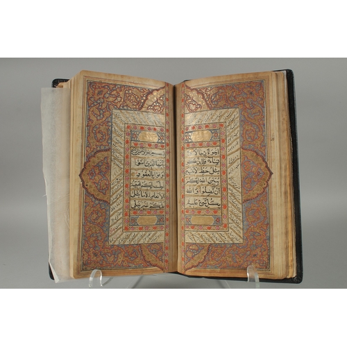 241 - A 19TH CENTURY NORTH INDIAN KASHMIR LEATHER BOUND ILLUMINATED QURAN, the manuscript written in naskh... 