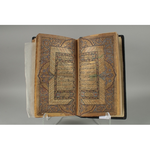 241 - A 19TH CENTURY NORTH INDIAN KASHMIR LEATHER BOUND ILLUMINATED QURAN, the manuscript written in naskh... 