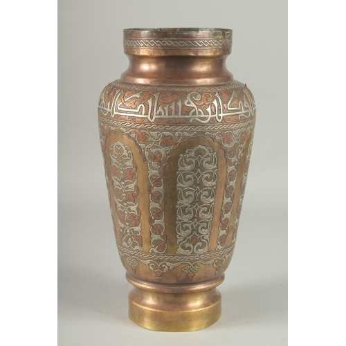 249 - AN EYGPTIAN OR SYRIAN SILVER AND COPPER INLAID BRASS VASE, the shoulder with calligraphic band, the ... 