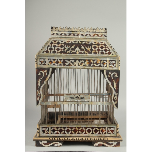 251 - AN EARLY 20TH CENTURY MOTHER OF PEARL AND TORTOISESHELL INLAID BIRD CAGE, 49cm high. 252.