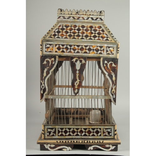 251 - AN EARLY 20TH CENTURY MOTHER OF PEARL AND TORTOISESHELL INLAID BIRD CAGE, 49cm high. 252.