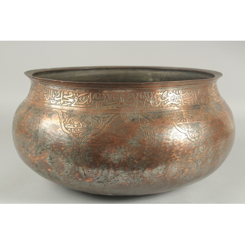 255 - A LARGE 17TH CENTURY TINNED COPPER BASIN, with calligraphy and engraved fish decoration, possibly De... 