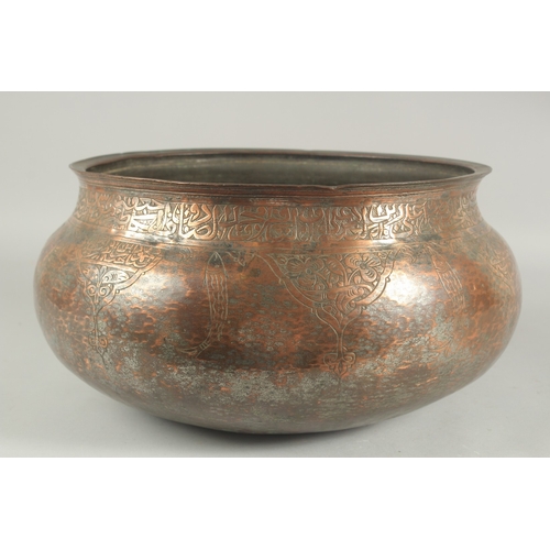 255 - A LARGE 17TH CENTURY TINNED COPPER BASIN, with calligraphy and engraved fish decoration, possibly De... 