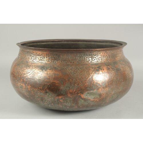 255 - A LARGE 17TH CENTURY TINNED COPPER BASIN, with calligraphy and engraved fish decoration, possibly De... 