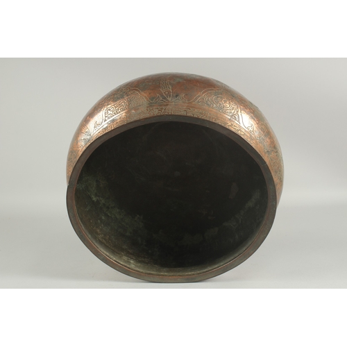 255 - A LARGE 17TH CENTURY TINNED COPPER BASIN, with calligraphy and engraved fish decoration, possibly De... 