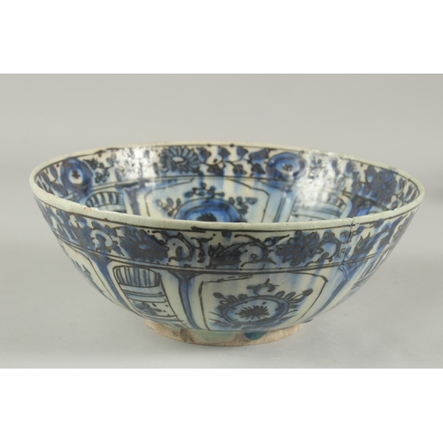 260 - A 17TH-18TH CENTURY PERSIAN SAFAVID GLAZED POTTERY BLUE AND WHITE BOWL, with signature at the base, ... 