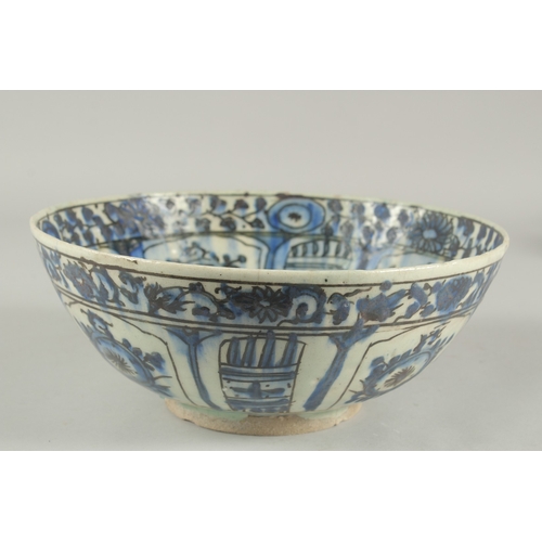 260 - A 17TH-18TH CENTURY PERSIAN SAFAVID GLAZED POTTERY BLUE AND WHITE BOWL, with signature at the base, ... 