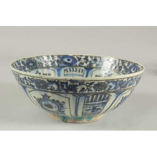 260 - A 17TH-18TH CENTURY PERSIAN SAFAVID GLAZED POTTERY BLUE AND WHITE BOWL, with signature at the base, ... 