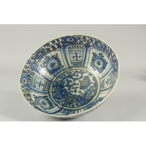 260 - A 17TH-18TH CENTURY PERSIAN SAFAVID GLAZED POTTERY BLUE AND WHITE BOWL, with signature at the base, ... 