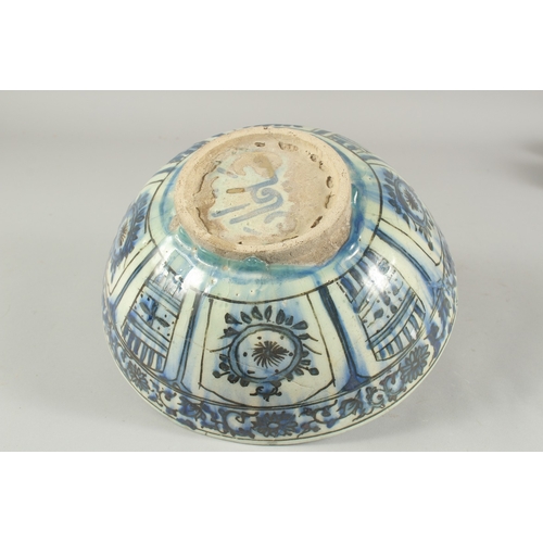 260 - A 17TH-18TH CENTURY PERSIAN SAFAVID GLAZED POTTERY BLUE AND WHITE BOWL, with signature at the base, ... 