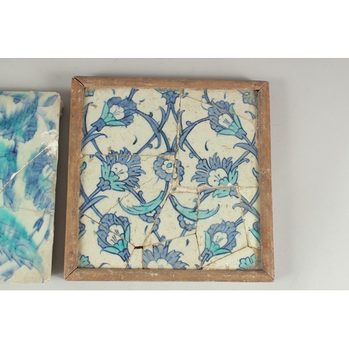 264 - TWO EARLY 17TH CENTURY OTTOMAN IZNIK BLUE AND WHITE GLAZED POTTERY TILES, each approx. 25cm square (... 