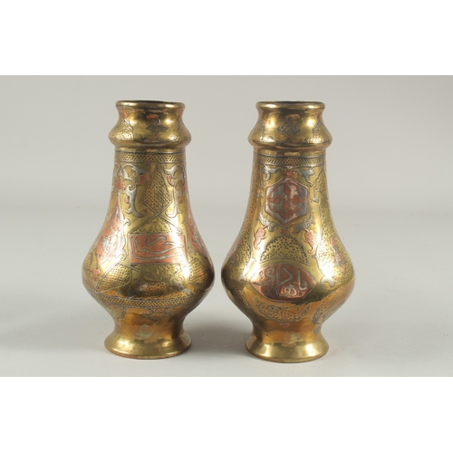 265 - A PAIR OF LATE 19TH-EARLY 20TH CENTURY SYRIAN DAMASCUS CAIROWARE SILVER AND COPPER INLAID VASES, 22c... 