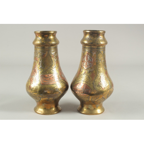 265 - A PAIR OF LATE 19TH-EARLY 20TH CENTURY SYRIAN DAMASCUS CAIROWARE SILVER AND COPPER INLAID VASES, 22c... 