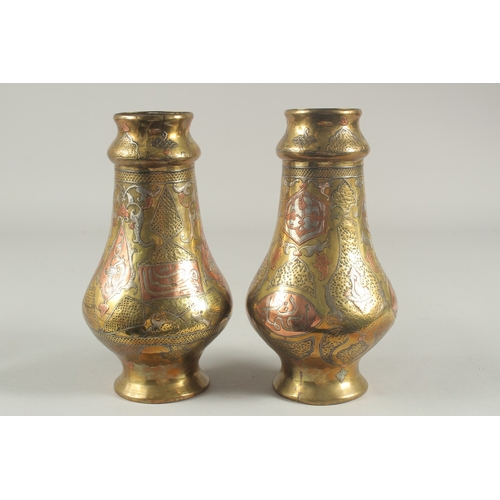 265 - A PAIR OF LATE 19TH-EARLY 20TH CENTURY SYRIAN DAMASCUS CAIROWARE SILVER AND COPPER INLAID VASES, 22c... 