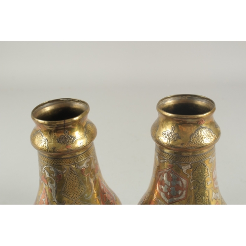 265 - A PAIR OF LATE 19TH-EARLY 20TH CENTURY SYRIAN DAMASCUS CAIROWARE SILVER AND COPPER INLAID VASES, 22c... 