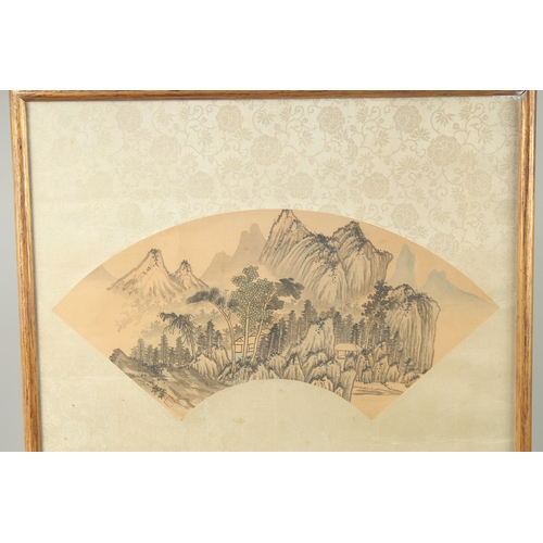 29 - TWO FRAMED CHINESE PAINTINGS ON SILK, one fan painting depicting a mountainous landscape, the other ... 