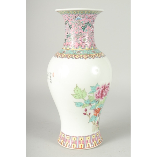 41 - A CHINESE REPUBLIC PERIOD FAMILLE ROSE PORCELAIN BALUSTER VASE, painted with peacocks and flora, the... 