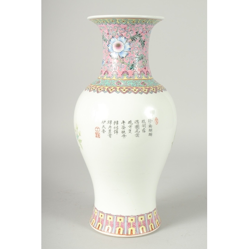 41 - A CHINESE REPUBLIC PERIOD FAMILLE ROSE PORCELAIN BALUSTER VASE, painted with peacocks and flora, the... 