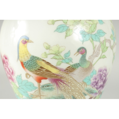 41 - A CHINESE REPUBLIC PERIOD FAMILLE ROSE PORCELAIN BALUSTER VASE, painted with peacocks and flora, the... 