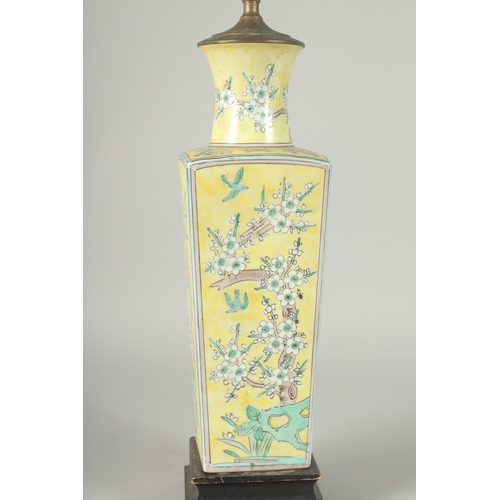 42 - A CHINESE FAMILLE JAUNE PORCELAIN SQUARE-FORM VASE, converted to a lamp, painted with blossoming pru... 