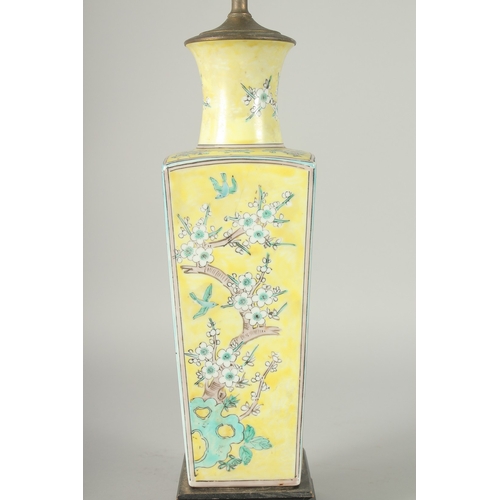 42 - A CHINESE FAMILLE JAUNE PORCELAIN SQUARE-FORM VASE, converted to a lamp, painted with blossoming pru... 