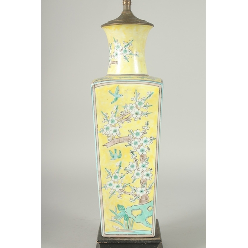 42 - A CHINESE FAMILLE JAUNE PORCELAIN SQUARE-FORM VASE, converted to a lamp, painted with blossoming pru... 