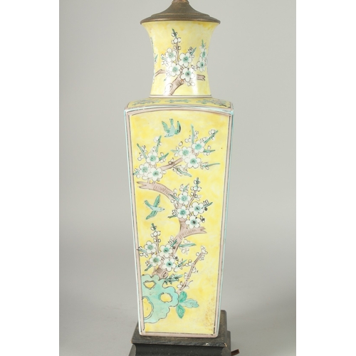 42 - A CHINESE FAMILLE JAUNE PORCELAIN SQUARE-FORM VASE, converted to a lamp, painted with blossoming pru... 