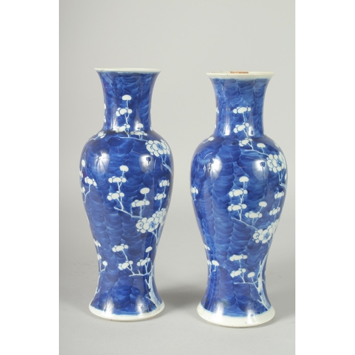 45 - A PAIR OF CHINESE BLUE AND WHITE PORCELAIN PRUNUS BALUSTER VASES, 30cm high.