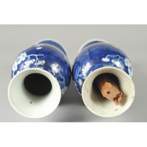 45 - A PAIR OF CHINESE BLUE AND WHITE PORCELAIN PRUNUS BALUSTER VASES, 30cm high.