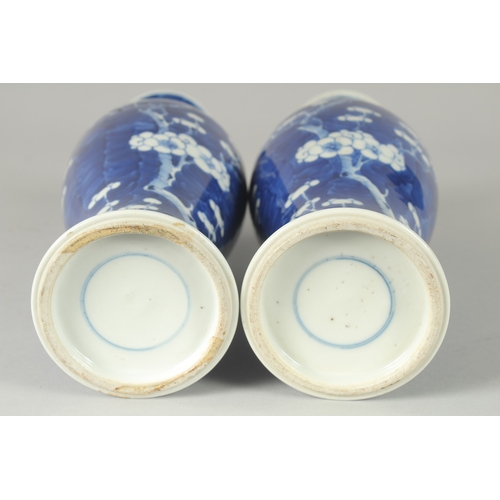 45 - A PAIR OF CHINESE BLUE AND WHITE PORCELAIN PRUNUS BALUSTER VASES, 30cm high.