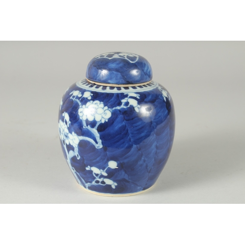 46 - A CHINESE BLUE AND WHITE PORCELAIN PRUNUS JAR AND COVER, (cover repair), 14.5cm high.