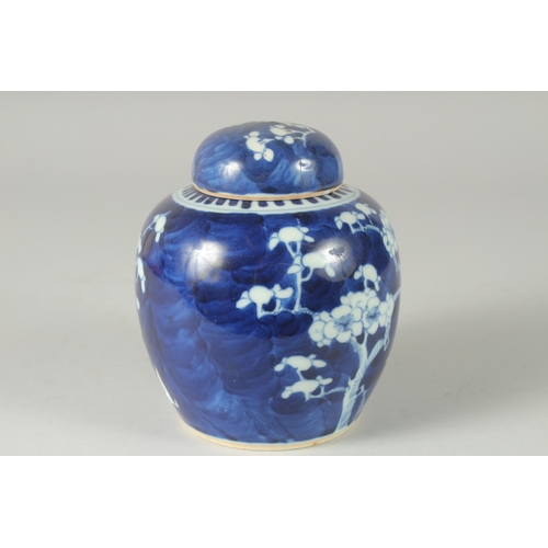 46 - A CHINESE BLUE AND WHITE PORCELAIN PRUNUS JAR AND COVER, (cover repair), 14.5cm high.