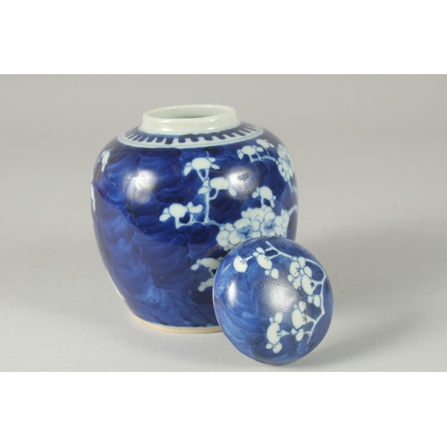 46 - A CHINESE BLUE AND WHITE PORCELAIN PRUNUS JAR AND COVER, (cover repair), 14.5cm high.