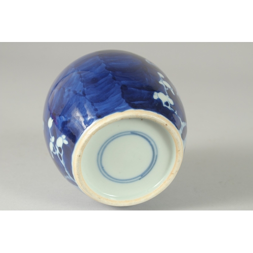 46 - A CHINESE BLUE AND WHITE PORCELAIN PRUNUS JAR AND COVER, (cover repair), 14.5cm high.