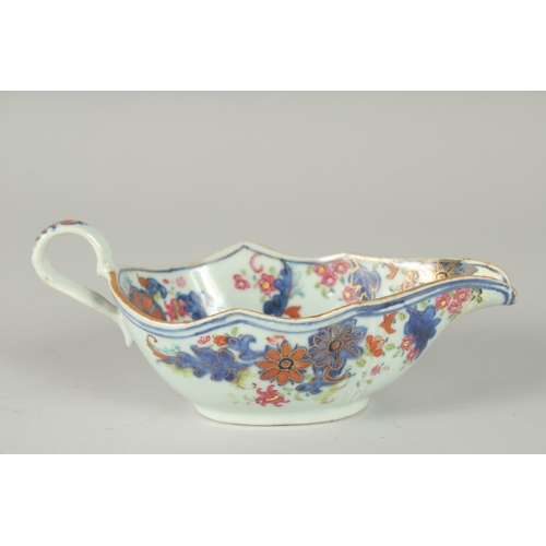 48 - A FAMILLE ROSE PORCELAIN SAUCE BOAT, with gilt highlights, (af), 21cm long.