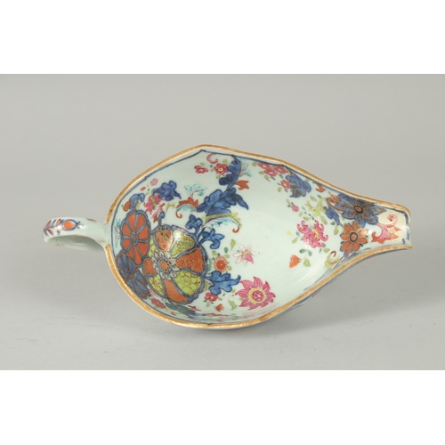 48 - A FAMILLE ROSE PORCELAIN SAUCE BOAT, with gilt highlights, (af), 21cm long.