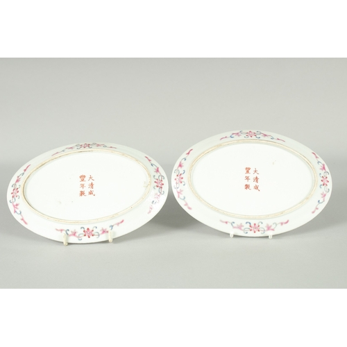 51 - A PAIR OF CHINESE YELLOW GROUND FAMILLE ROSE PORCELAIN OVAL DISHES, painted with dragon and flora, e... 