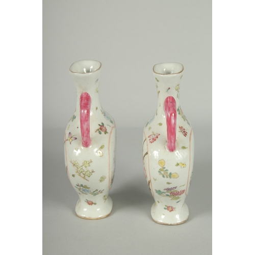 52 - A PAIR OF CHINESE FAMILLE ROSE PORCELAIN TWIN HANDLE VASES, painted with birds and flora, each base ... 