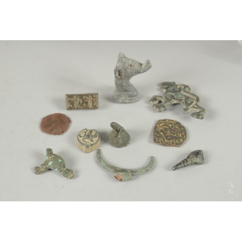 569 - A COLLECTION OF ISLAMIC - POSSIBLY NISHAPUR METAL RELICS, (qty).