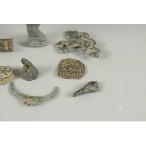 569 - A COLLECTION OF ISLAMIC - POSSIBLY NISHAPUR METAL RELICS, (qty).