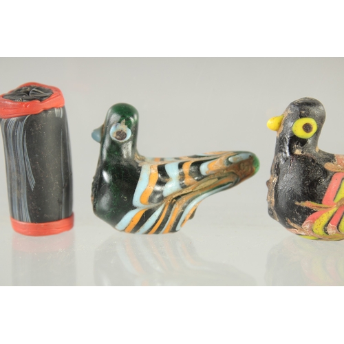 579 - FOUR ISLAMIC GLASS PIECES, together with a ring and a cylindrical bead, (6).