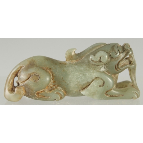 581 - A CARVED JADE LION DOG, 7.5cm long.