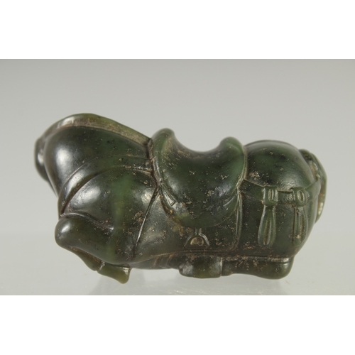 583 - A GREEN HARDSTONE FIGURE OF A HORSE, 7cm long.