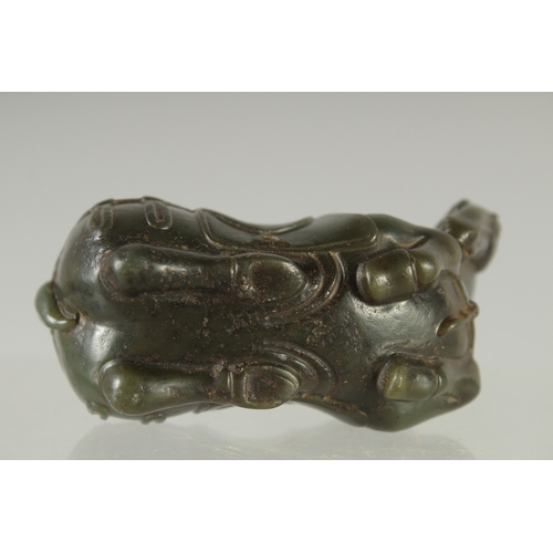 583 - A GREEN HARDSTONE FIGURE OF A HORSE, 7cm long.