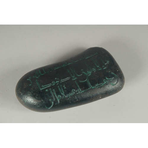 584 - AN ISLAMIC KUFI WRITING STONE.