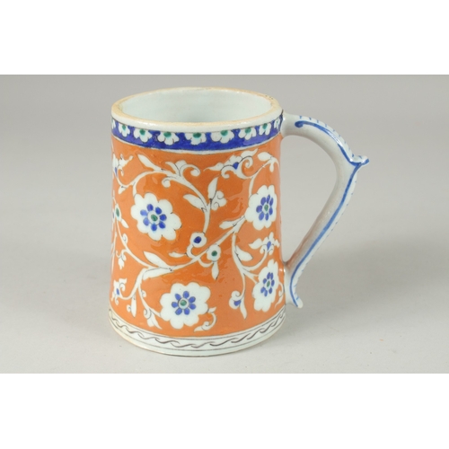 590 - AN OTTOMAN TURKISH POTTERY TANKARD, 15cm high.