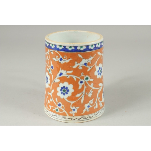 590 - AN OTTOMAN TURKISH POTTERY TANKARD, 15cm high.