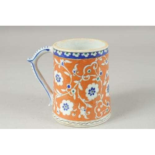 590 - AN OTTOMAN TURKISH POTTERY TANKARD, 15cm high.